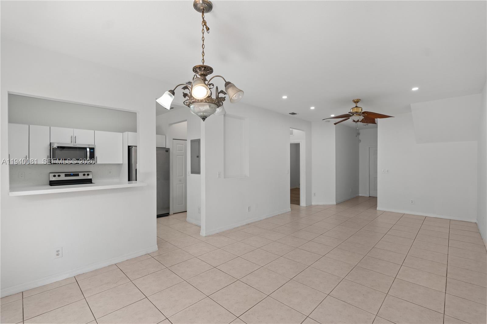 1564 Southwest 2nd Street Homestead, FL 33030 - Photo 5 of 29 a view of a kitchen with a sink and refrigerator