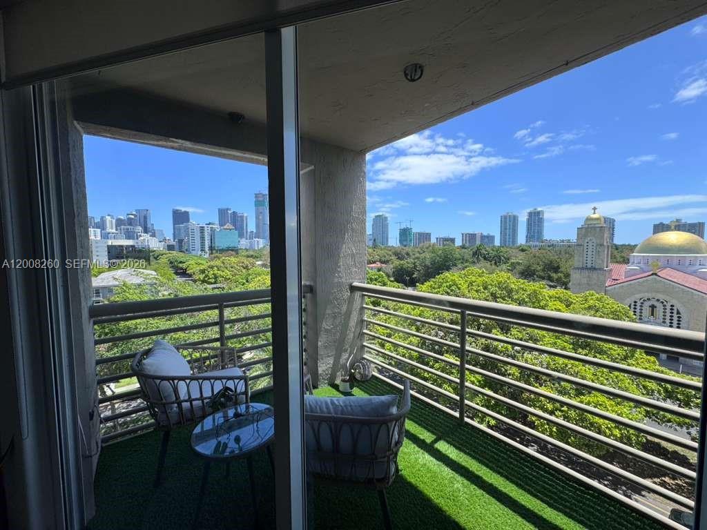 2400 Southwest 3rd Avenue, Unit 601 Miami, FL 33129 - Photo 1 of 21 a city view from a balcony with outdoor seating