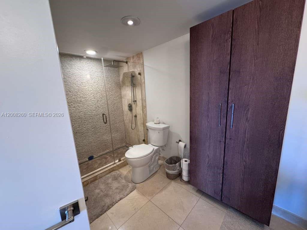 2400 Southwest 3rd Avenue, Unit 601 Miami, FL 33129 - Photo 13 of 21 a bathroom with a toilet and a shower