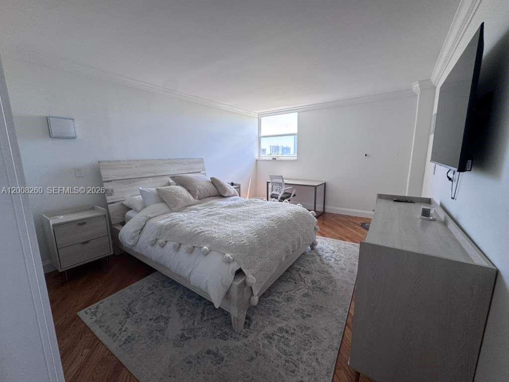 2400 Southwest 3rd Avenue, Unit 601 Miami, FL 33129 - Photo 15 of 21 a bedroom with a bed and a flat screen tv