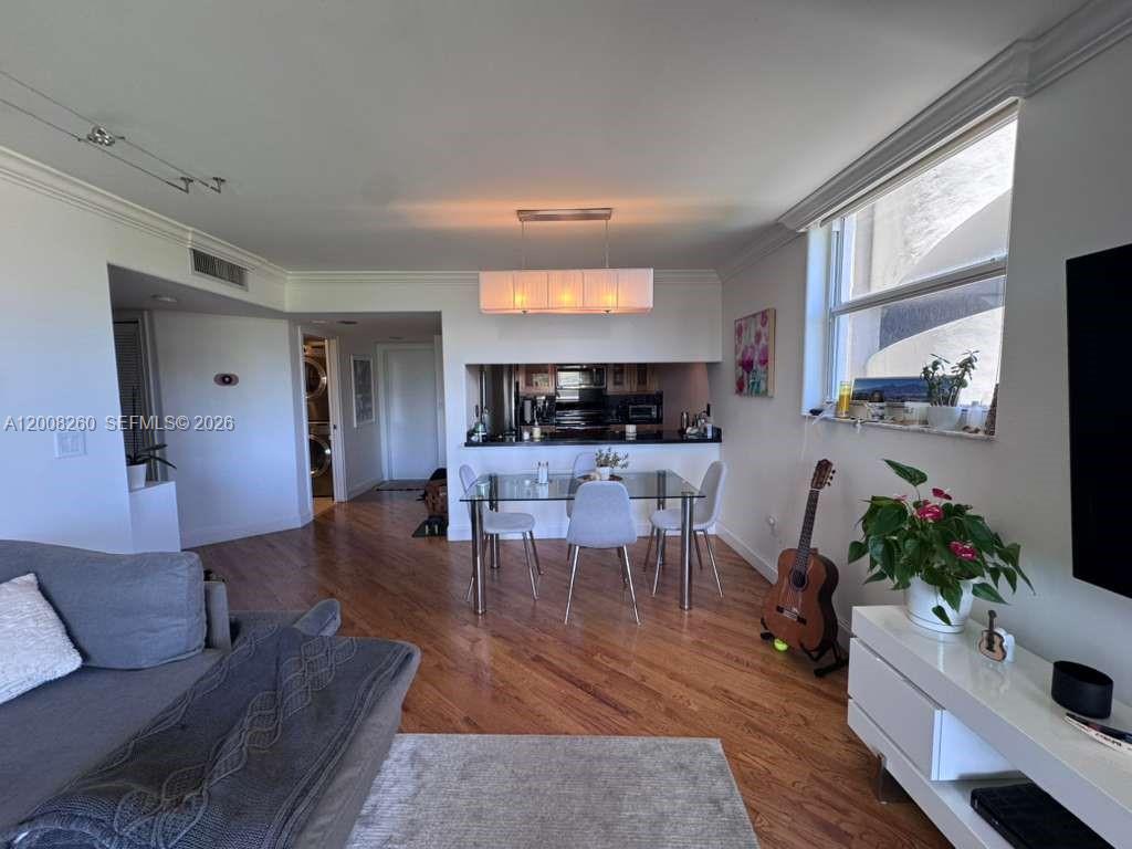 2400 Southwest 3rd Avenue, Unit 601 Miami, FL 33129 - Photo 6 of 21 a living room with furniture potted plant and kitchen view