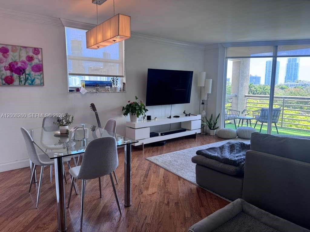 2400 Southwest 3rd Avenue, Unit 601 Miami, FL 33129 - Photo 7 of 21 a living room with furniture and a flat screen tv