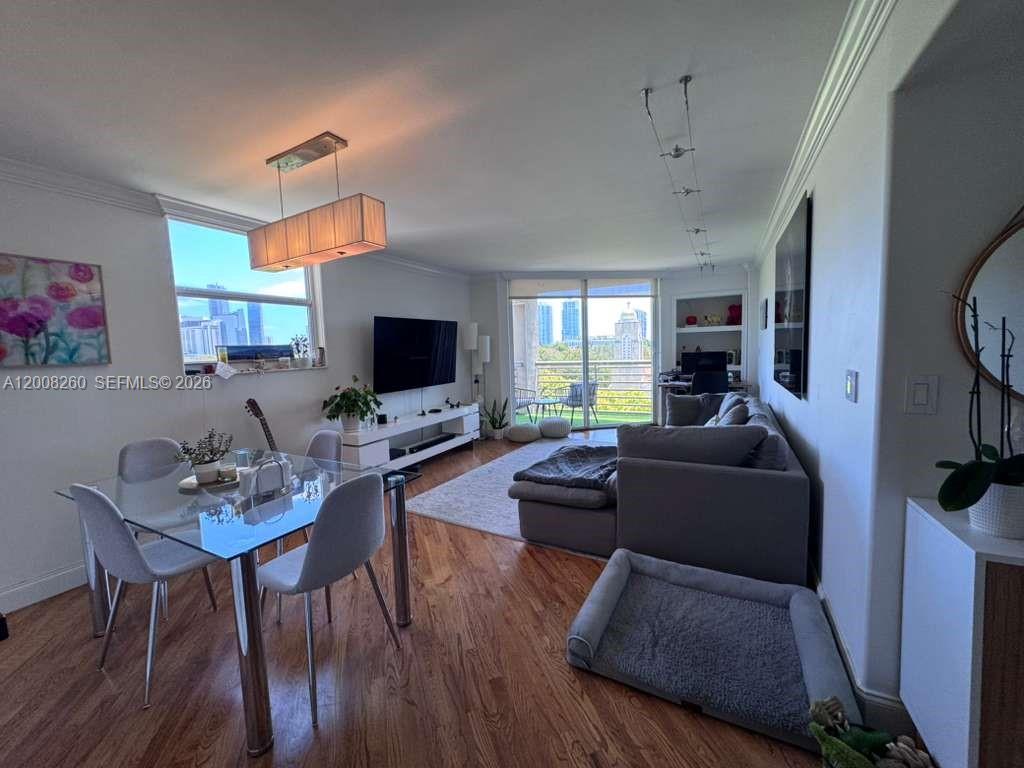2400 Southwest 3rd Avenue, Unit 601 Miami, FL 33129 - Photo 8 of 21 a living room with furniture flat screen tv and wooden floor