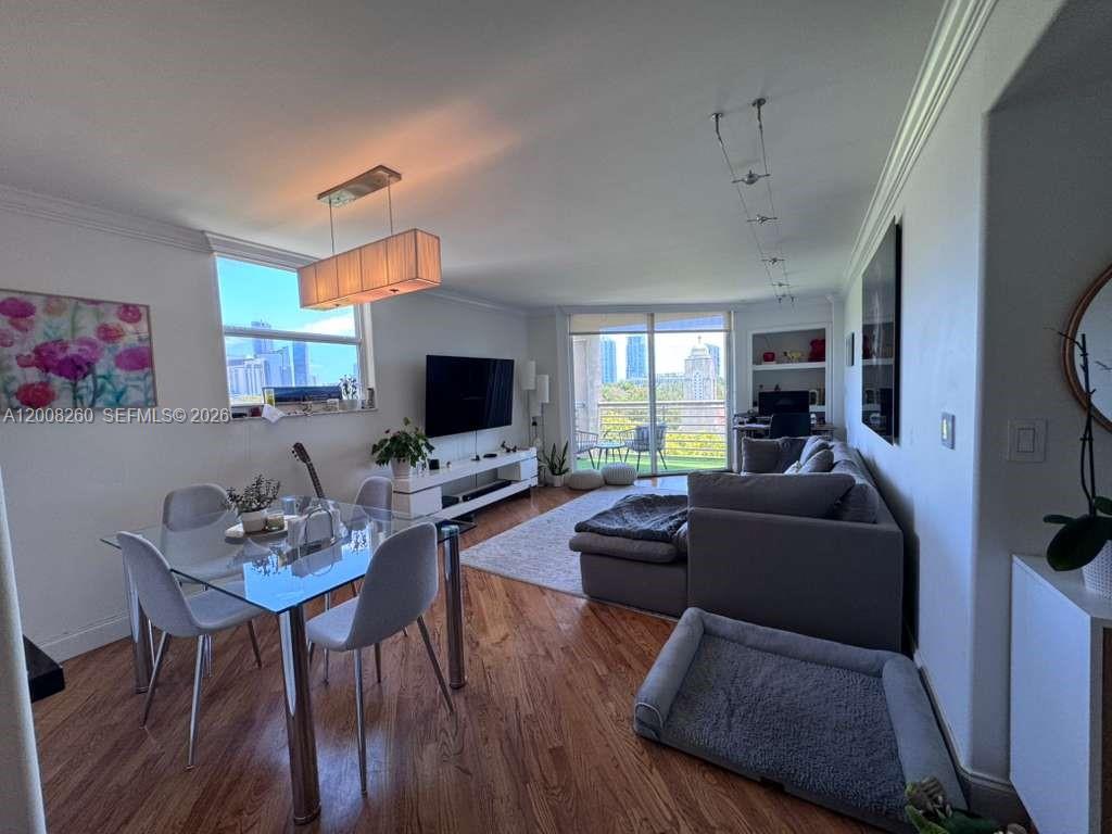 2400 Southwest 3rd Avenue, Unit 601 Miami, FL 33129 - Photo 9 of 21 a living room with furniture and a flat screen tv