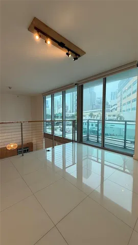 a view of hall way with furniture