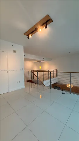 a bathroom with a shower and a window