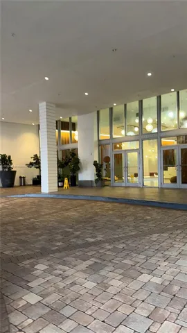 a view of a room with gym equipment and a large window