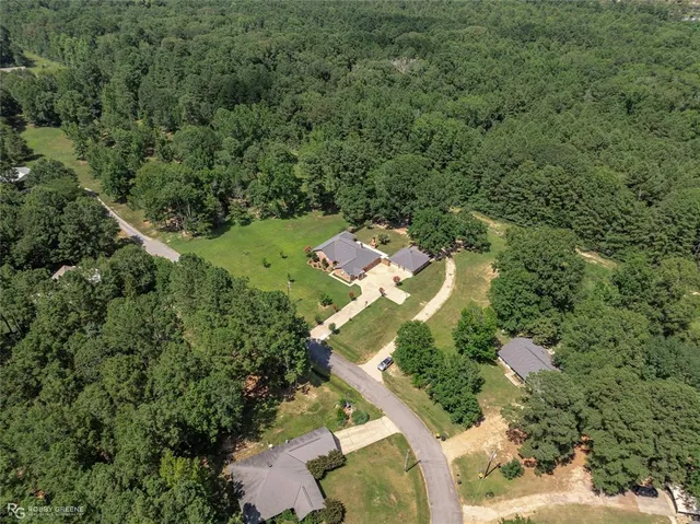 an aerial view of residential house with outdoor space
