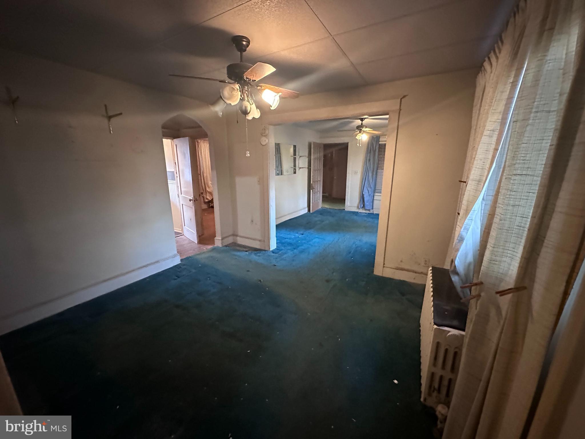 4719 Rittenhouse Street Riverdale, MD 20737 - Photo 3 of 15 wooden floor in an empty room with a window