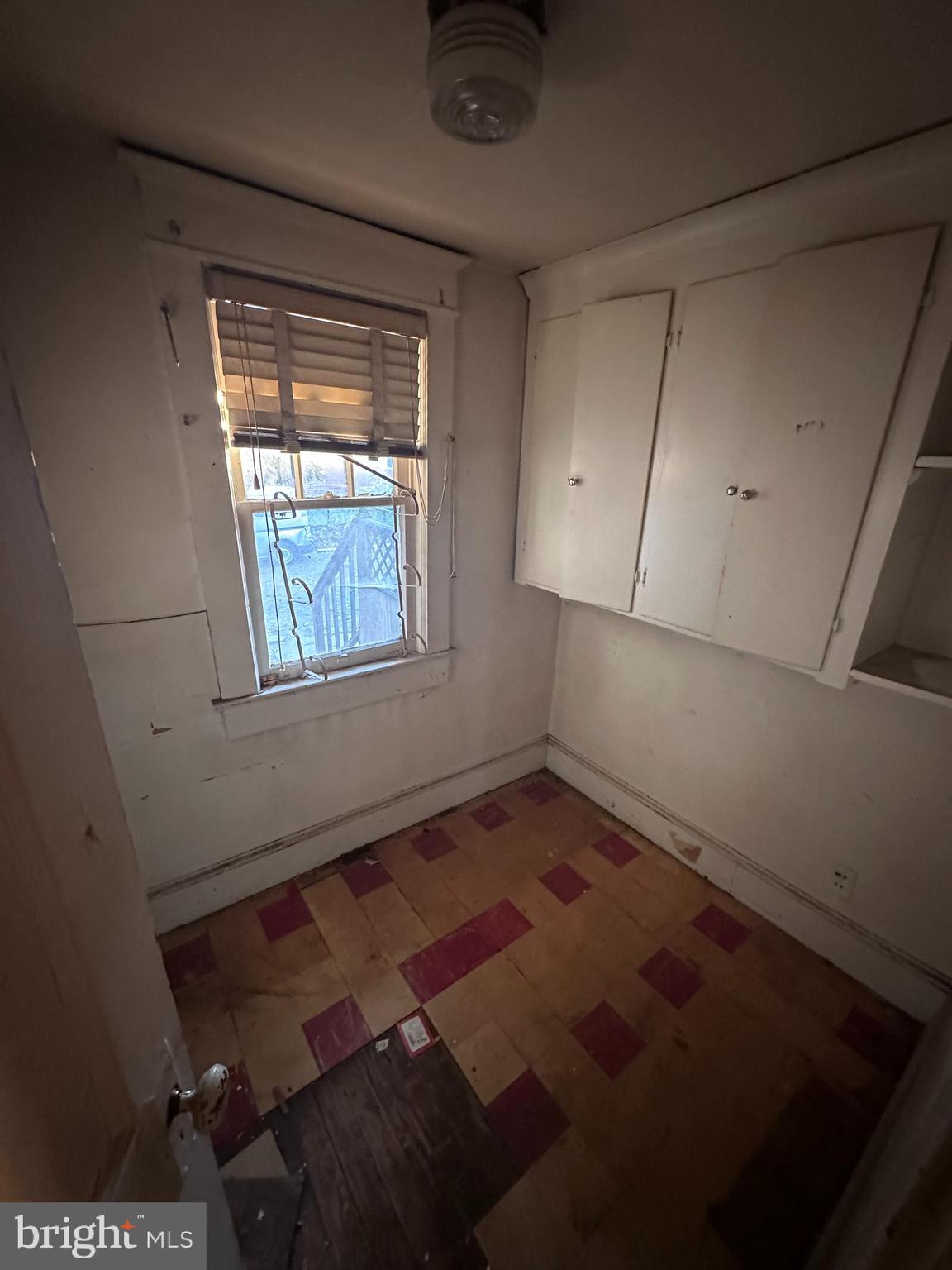 4719 Rittenhouse Street Riverdale, MD 20737 - Photo 4 of 15 a view of an empty room with a window