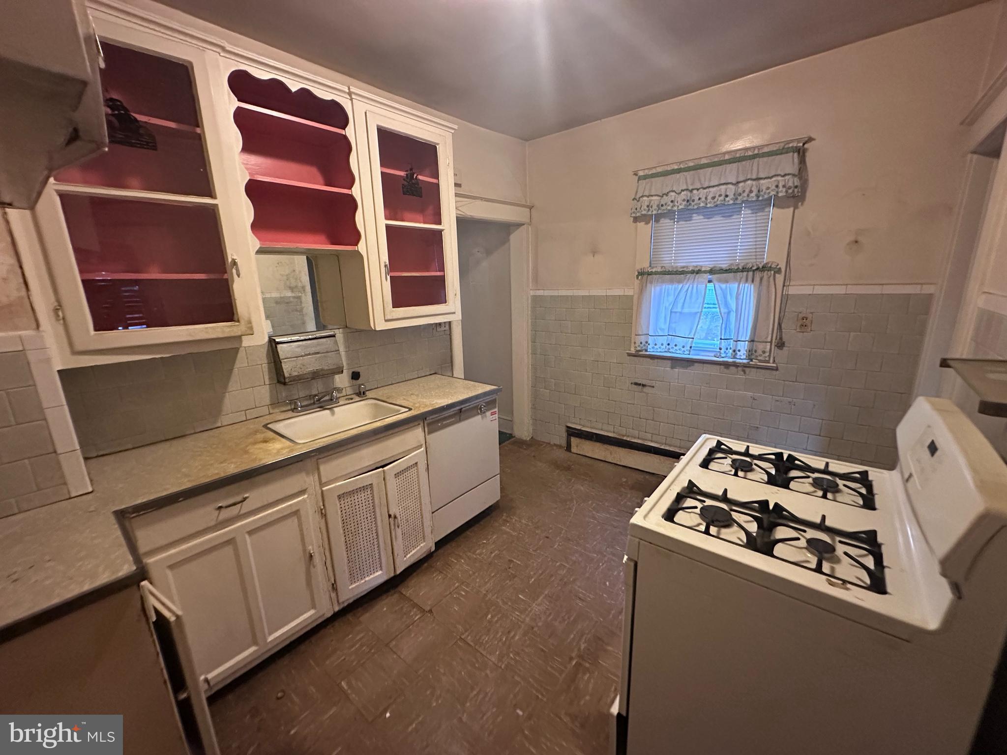 4719 Rittenhouse Street Riverdale, MD 20737 - Photo 6 of 15 a kitchen with stainless steel appliances a stove a sink and a refrigerator