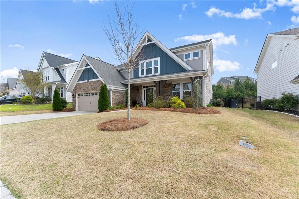 147 Michigan Circle Hoschton, GA 30548 - Photo 4 of 85 a front view of a house with a yard