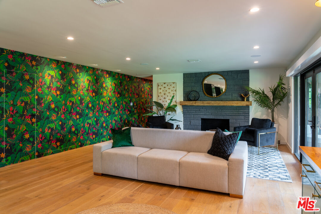 16666 Oldham Street Encino, CA 91436 - Photo 13 of 43 a living room with furniture and a fireplace