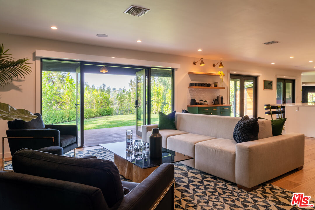 16666 Oldham Street Encino, CA 91436 - Photo 16 of 43 a living room with furniture and a large window
