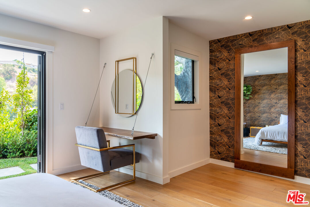 16666 Oldham Street Encino, CA 91436 - Photo 21 of 43 a living room with furniture and a window