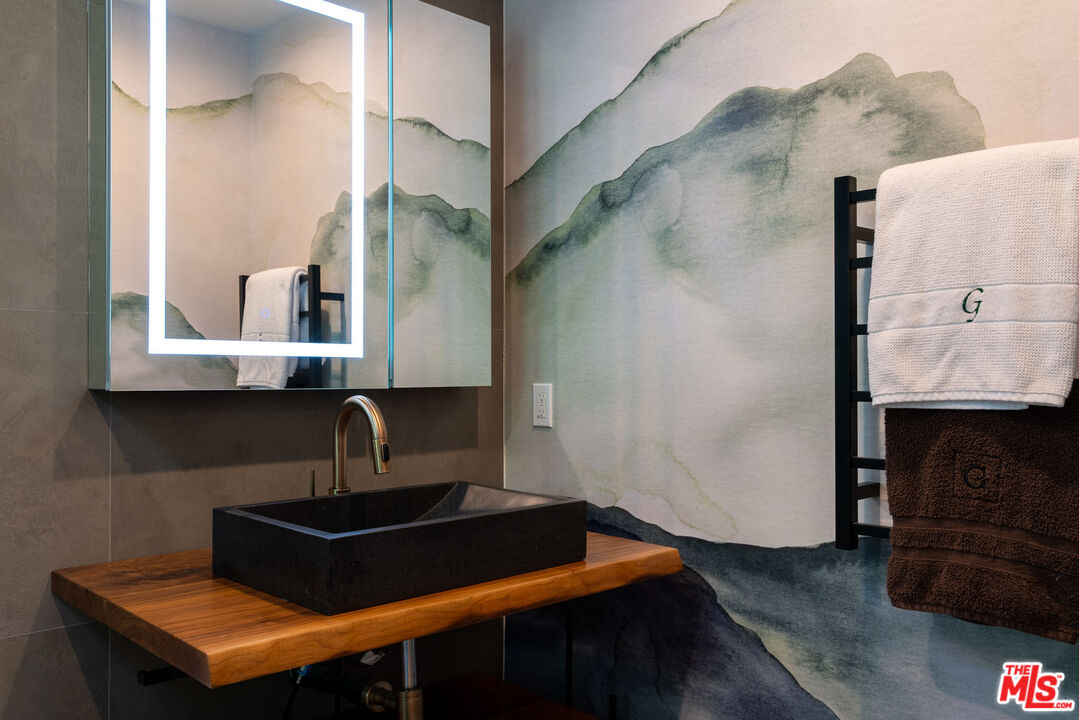 16666 Oldham Street Encino, CA 91436 - Photo 29 of 43 a living room with furniture and a fireplace