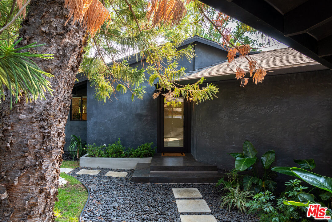 16666 Oldham Street Encino, CA 91436 - Photo 4 of 43 a view of a house with a yard