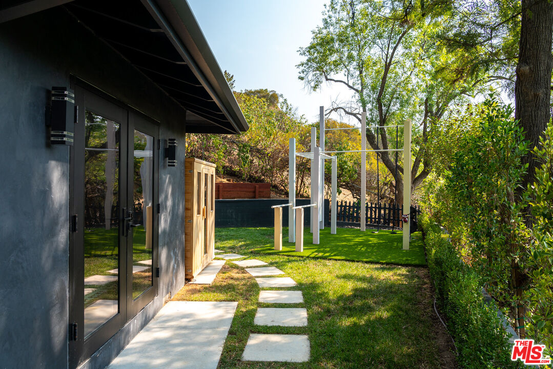 16666 Oldham Street Encino, CA 91436 - Photo 34 of 43 a view of a house with a yard