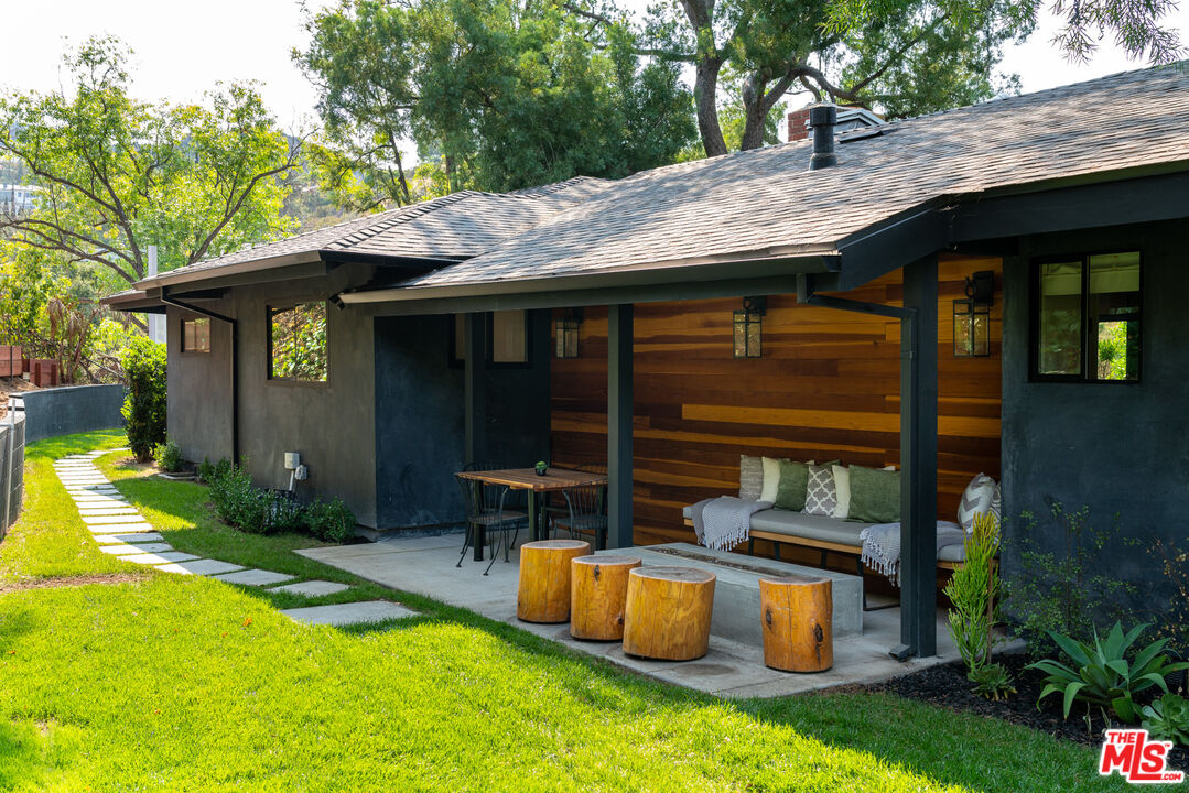 16666 Oldham Street Encino, CA 91436 - Photo 36 of 43 a view of an house with backyard space and patio