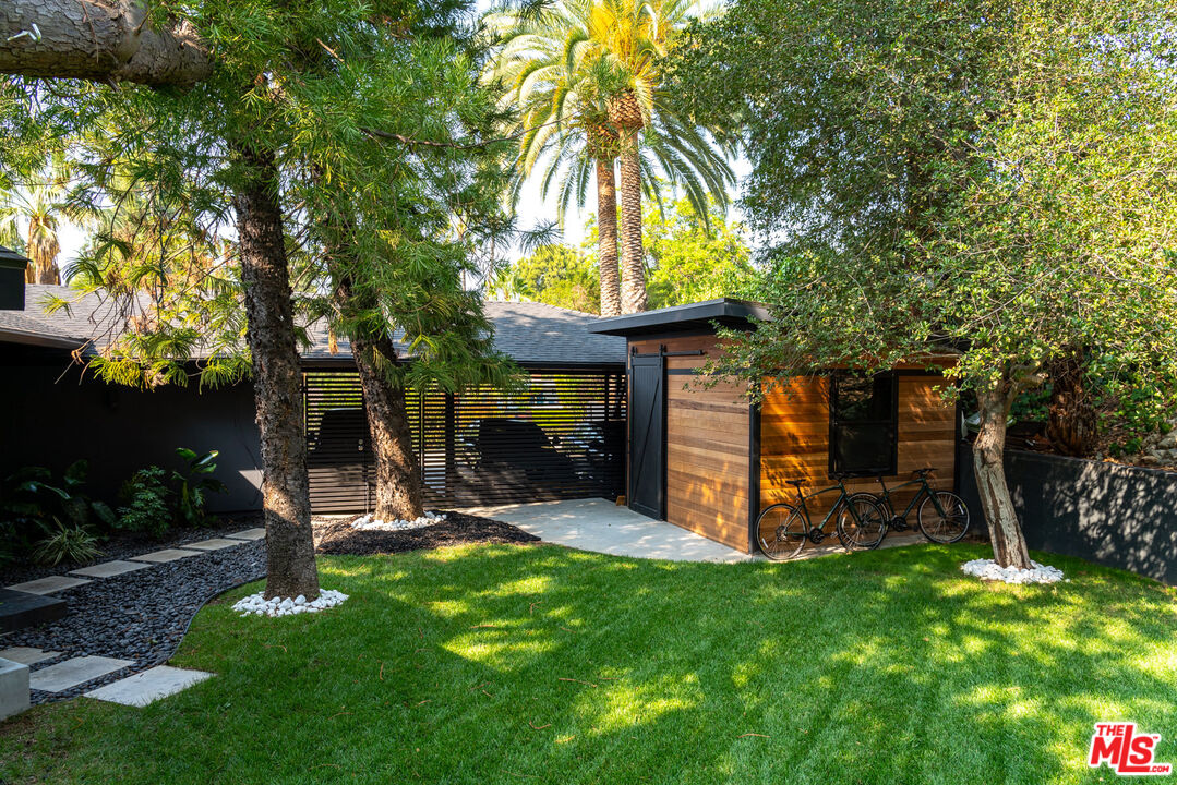 16666 Oldham Street Encino, CA 91436 - Photo 38 of 43 a view of a chair and table in backyard of the house