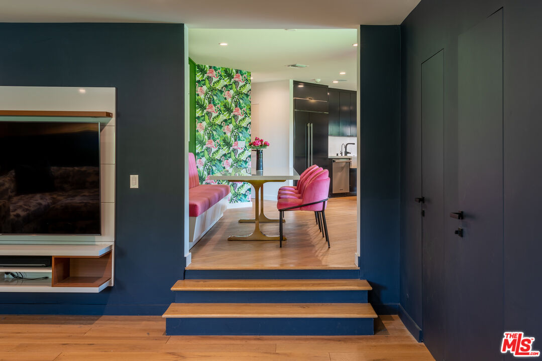 16666 Oldham Street Encino, CA 91436 - Photo 8 of 43 a room with wooden floor and furniture