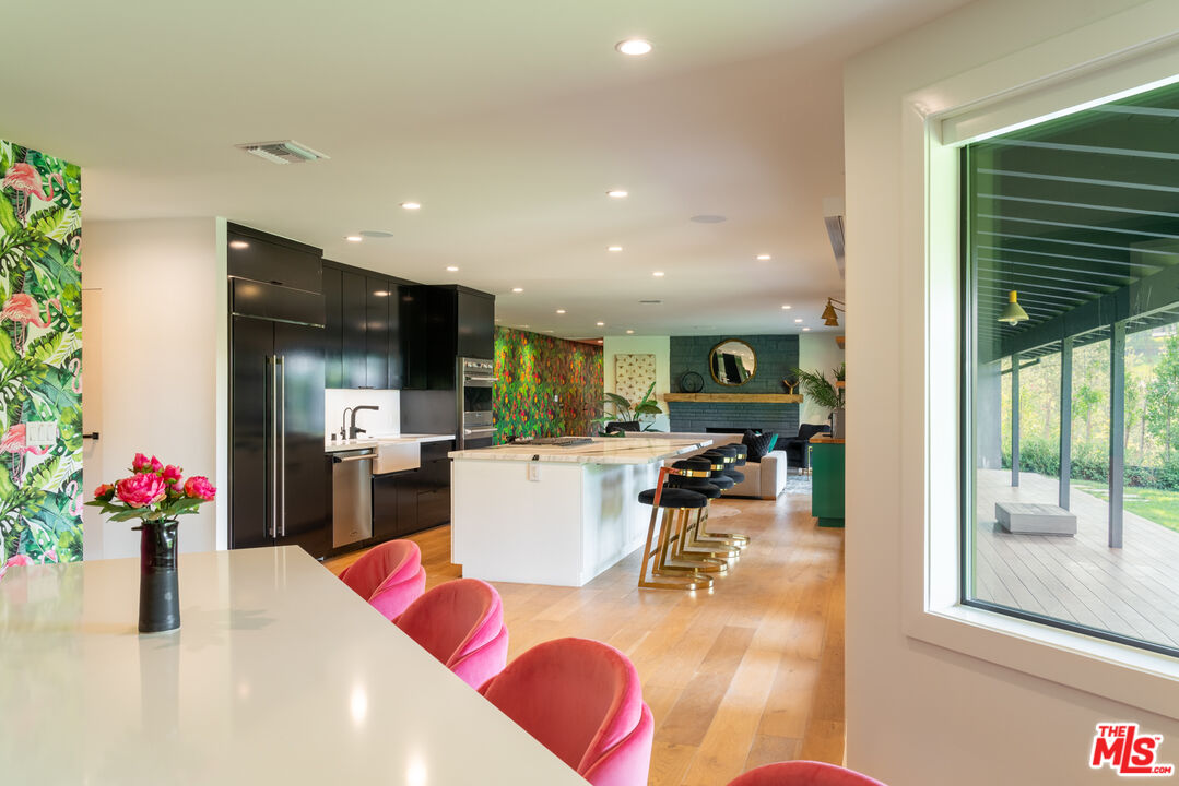 16666 Oldham Street Encino, CA 91436 - Photo 9 of 43 a living room with dining room and wooden floor
