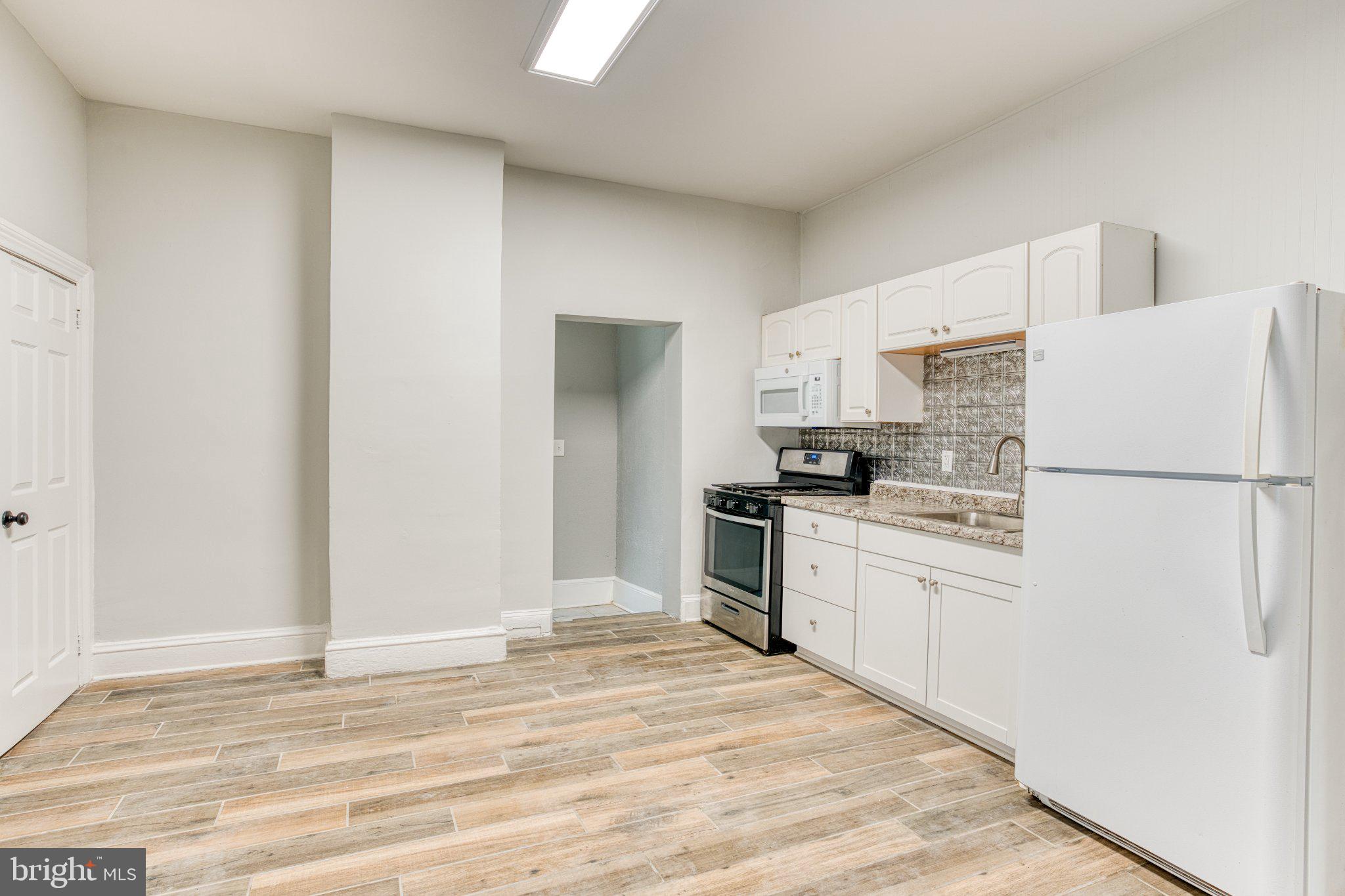 75 Ellis Street Haddonfield, NJ 08033 - Photo 7 of 22 Modern kitchen with sleek finishes.