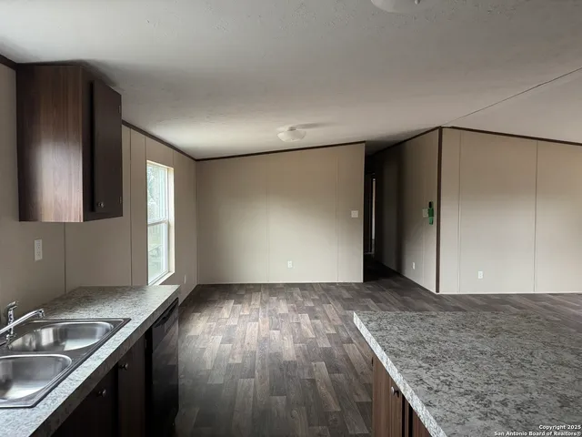 a view of a kitchen cabinets a sink and dishwasher