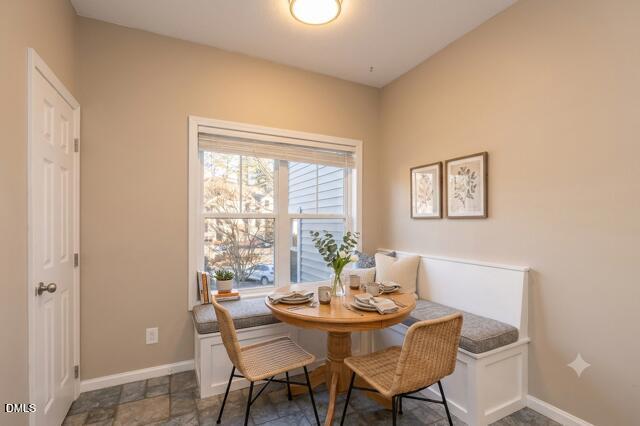 6011 Winterpointe Lane Raleigh, NC 27606 - Photo 6 of 17 a view of a dining room with furniture window and outside view