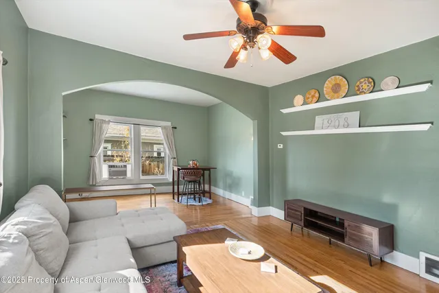 a living room with furniture and a window