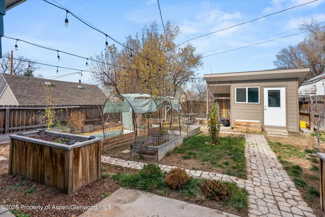 a view of a backyard with sitting area