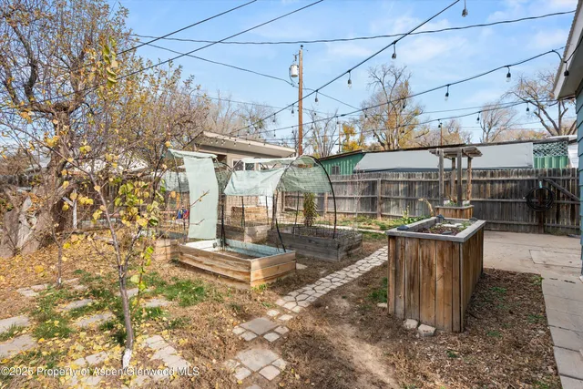 a view of a bench in the backyard