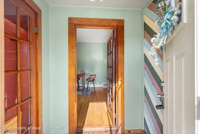 a view of an entryway with a mirror