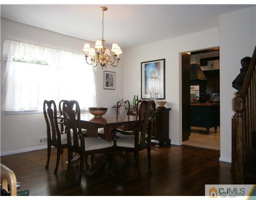 42 Clive Hills Road Edison, NJ 08820 - Photo 5 of 17 a view of a dining room with furniture and chandelier