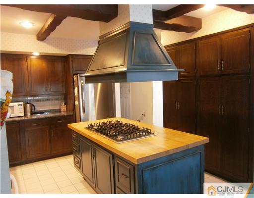 42 Clive Hills Road Edison, NJ 08820 - Photo 8 of 17 a kitchen with a sink cabinets and stainless steel appliances