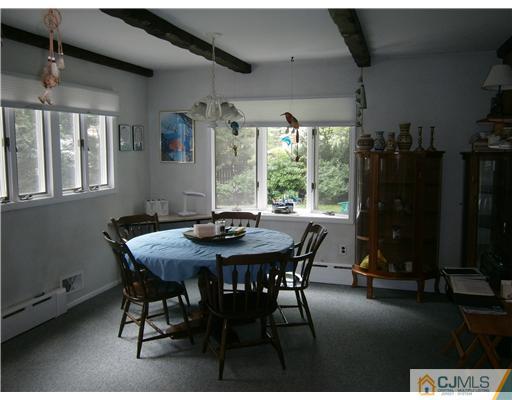 42 Clive Hills Road Edison, NJ 08820 - Photo 9 of 17 a view of a dining room with furniture window and outside view