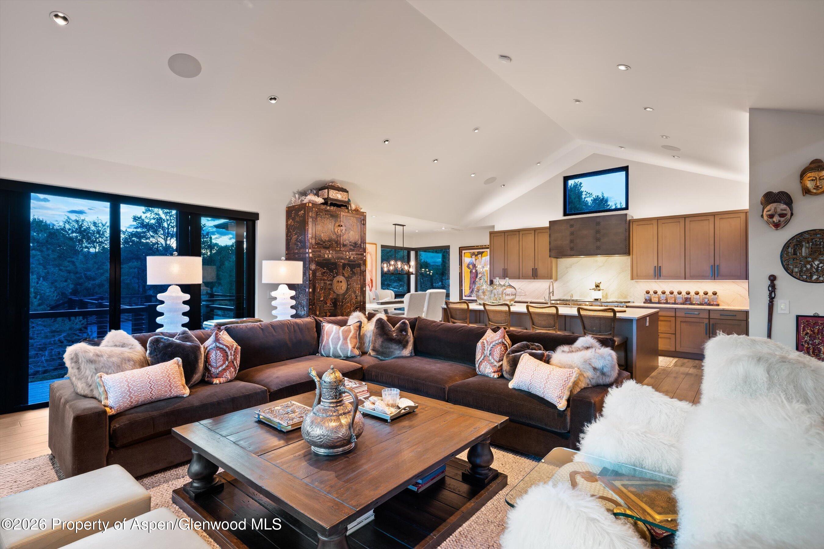 258 Monarch Road Glenwood Springs, CO 81601 - Photo 11 of 73 a living room with furniture fireplace and a large window