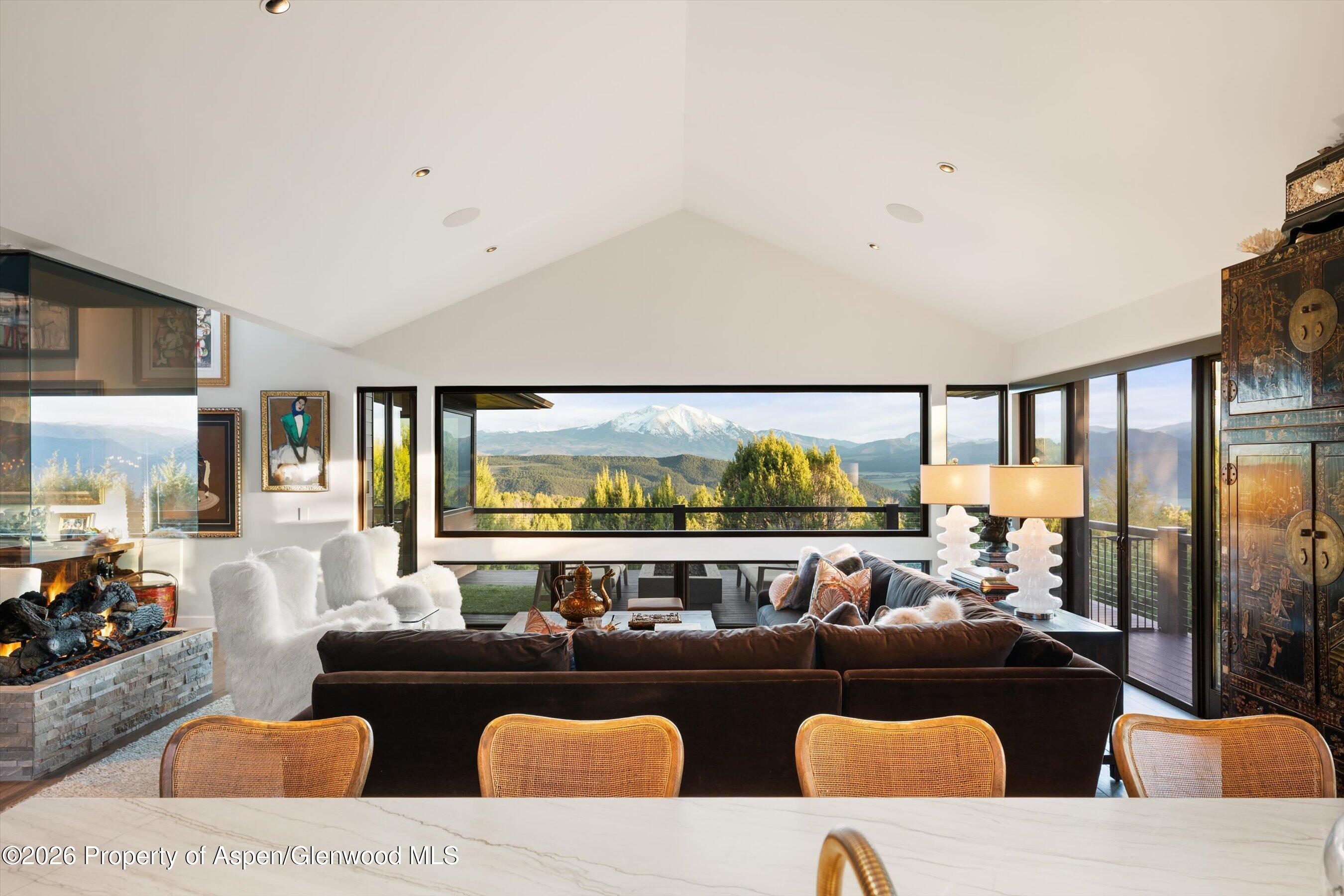 258 Monarch Road Glenwood Springs, CO 81601 - Photo 13 of 73 a living room with furniture and floor to ceiling window