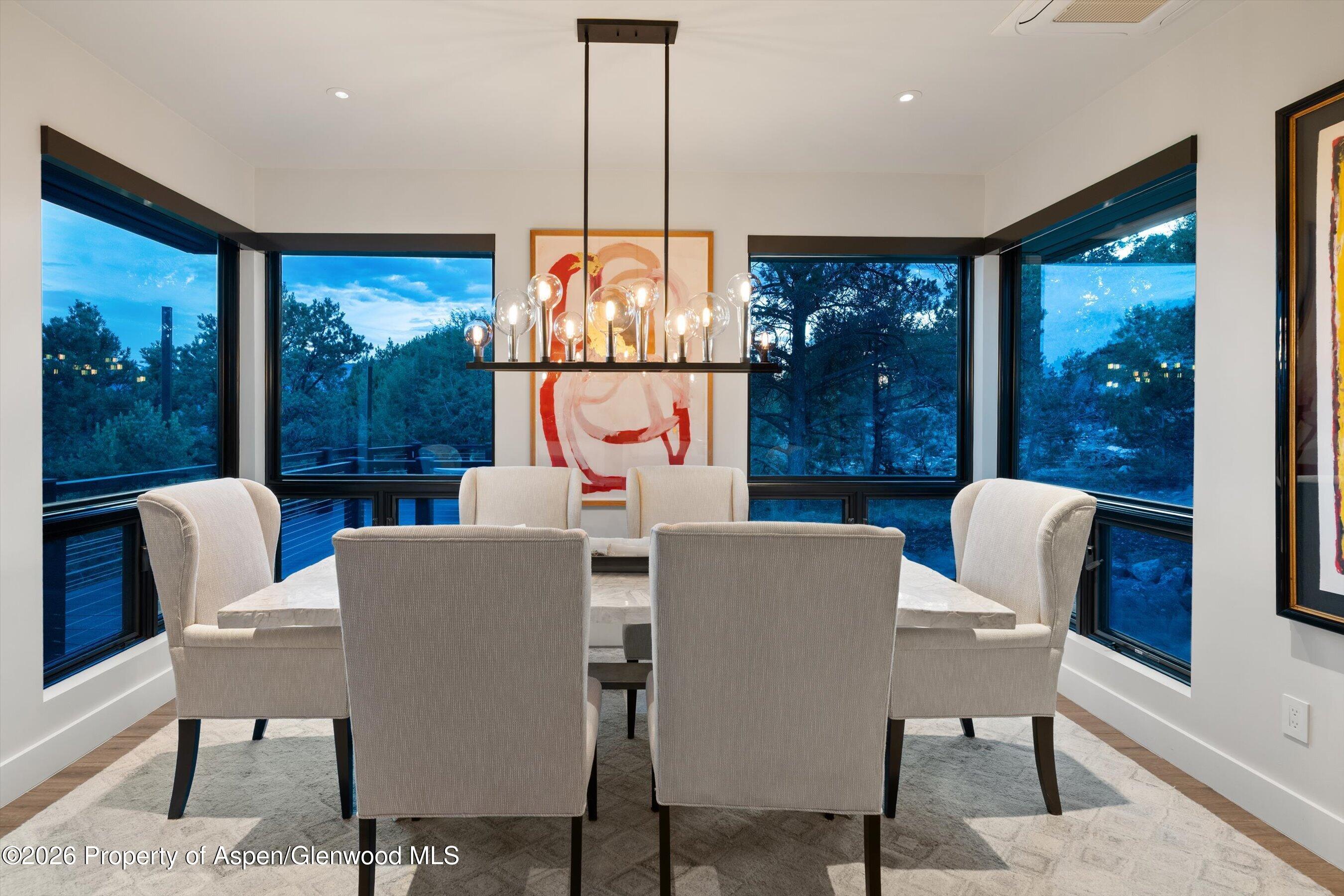 258 Monarch Road Glenwood Springs, CO 81601 - Photo 16 of 73 a dining room with furniture a chandelier and glass door