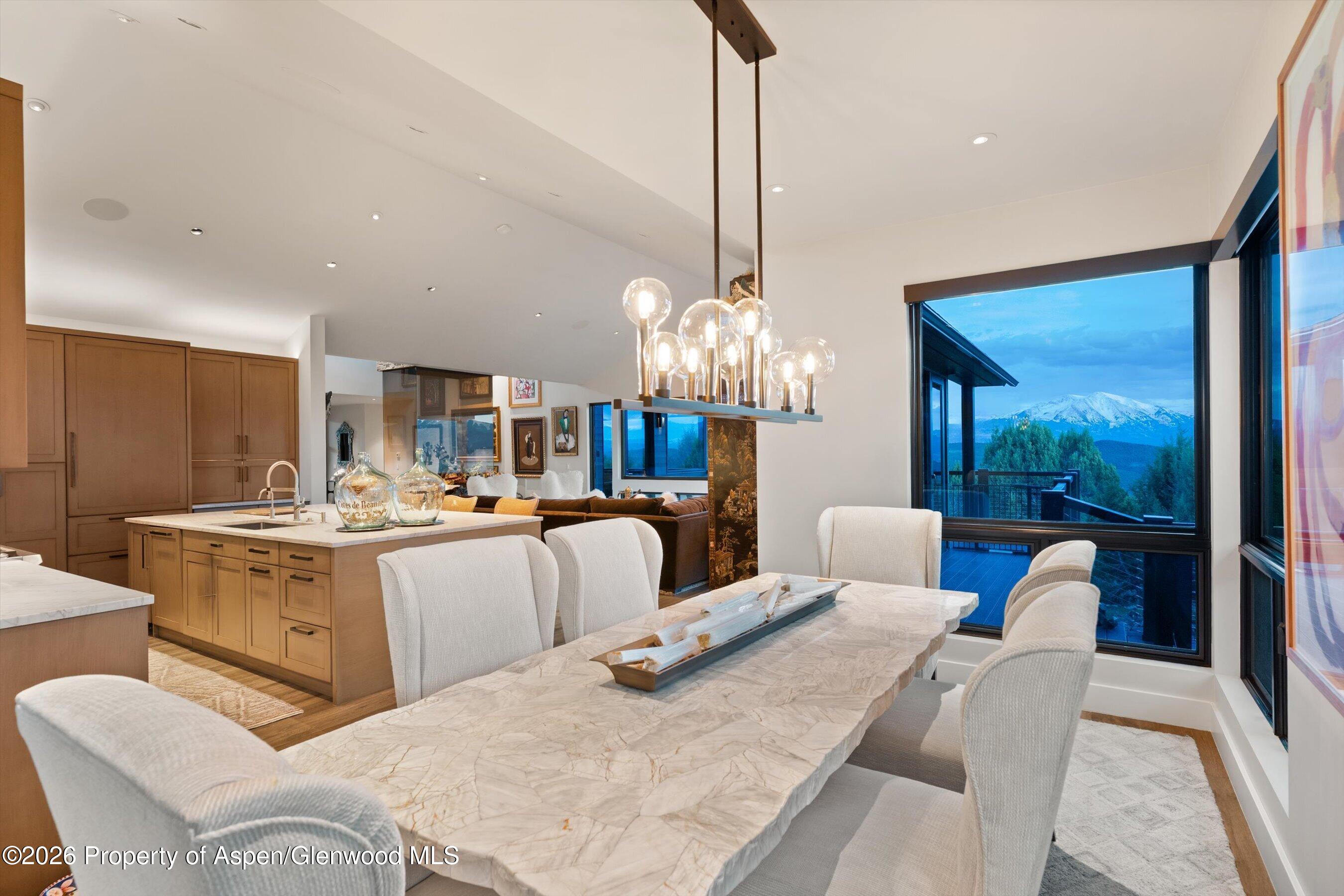 258 Monarch Road Glenwood Springs, CO 81601 - Photo 17 of 73 a large white kitchen with a large island