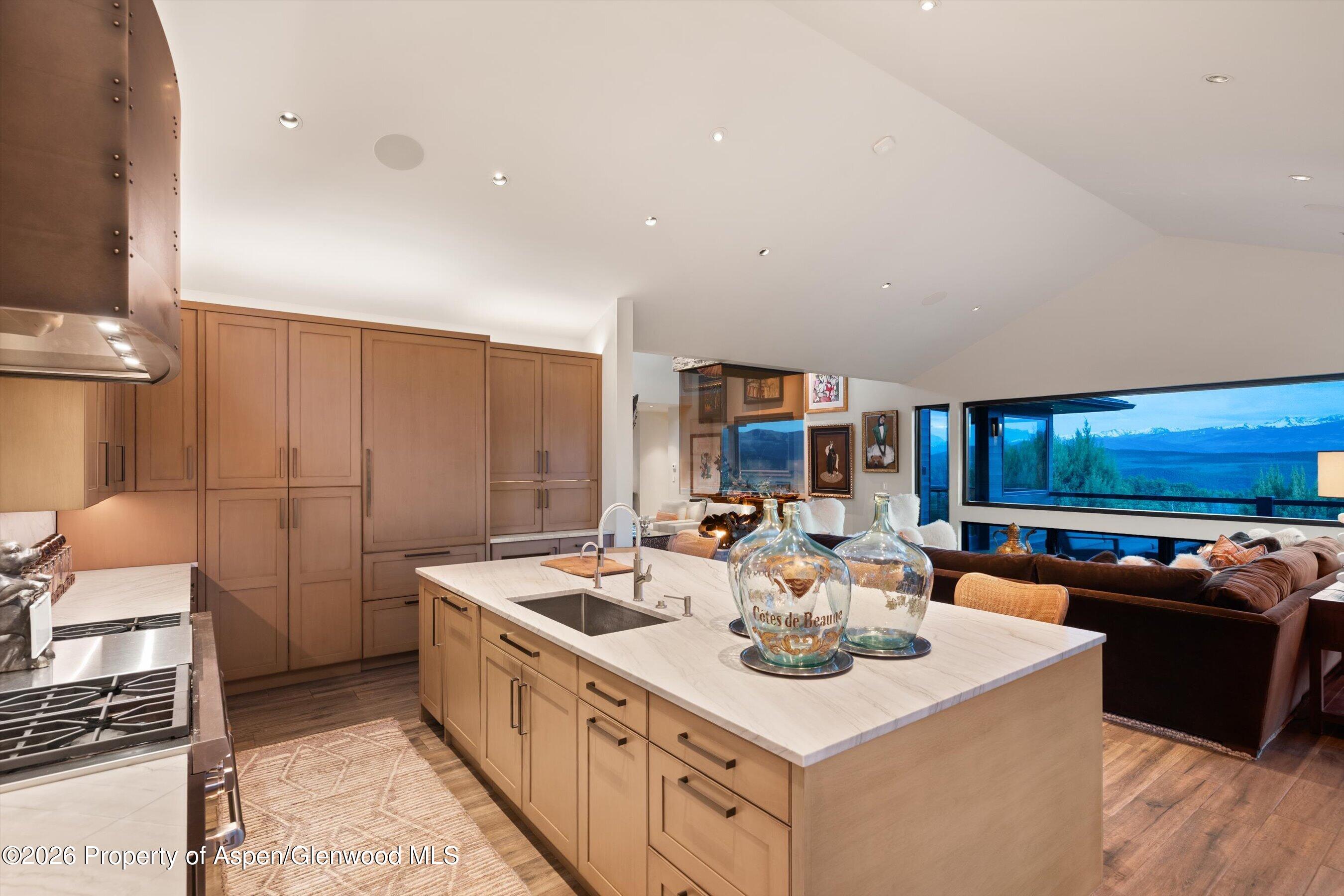 258 Monarch Road Glenwood Springs, CO 81601 - Photo 22 of 73 a kitchen with stainless steel appliances a sink a stove and a refrigerator