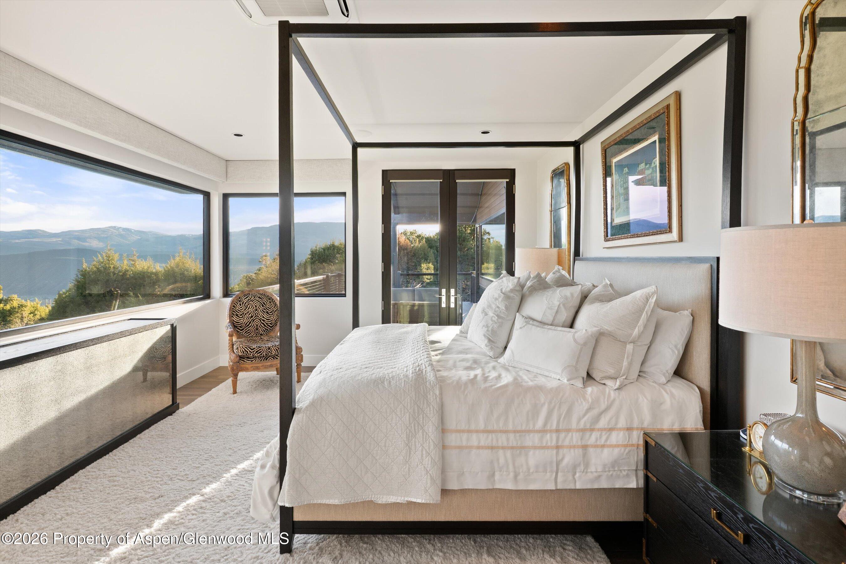 258 Monarch Road Glenwood Springs, CO 81601 - Photo 24 of 73 a bedroom with a large bed and a large window