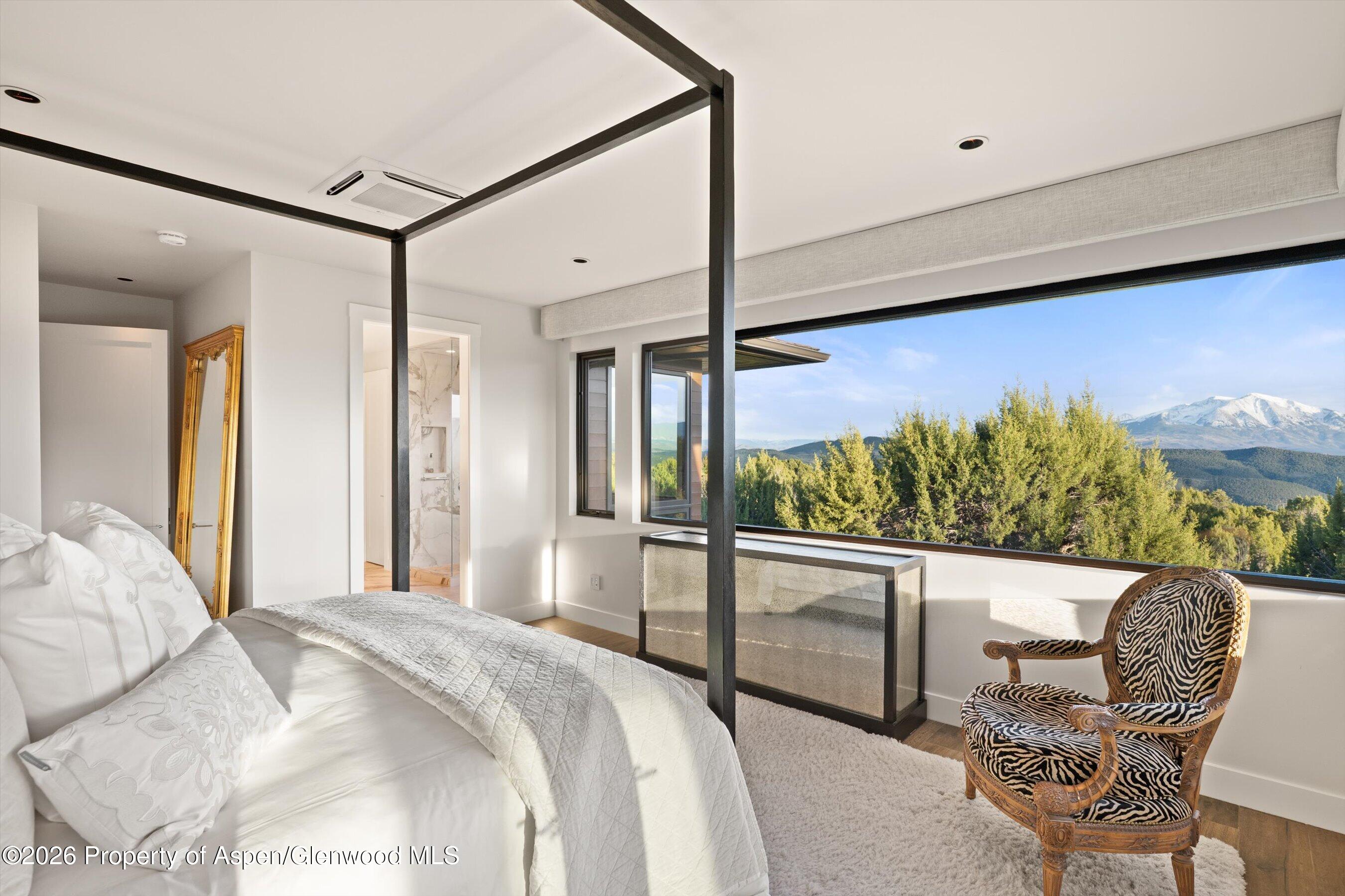 258 Monarch Road Glenwood Springs, CO 81601 - Photo 25 of 73 a bedroom with a bed and chair