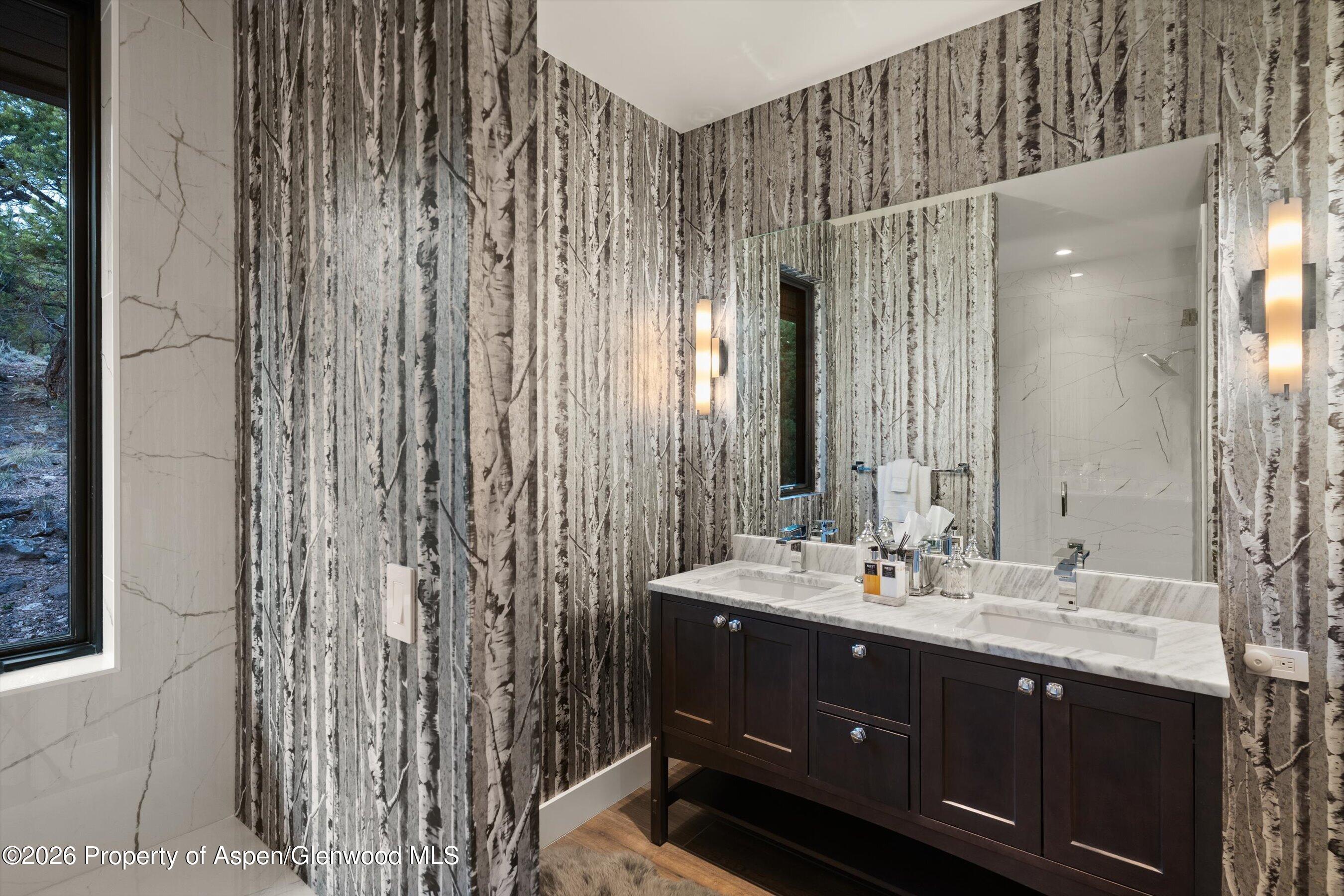 258 Monarch Road Glenwood Springs, CO 81601 - Photo 30 of 73 a bathroom with a double vanity sink and a mirror