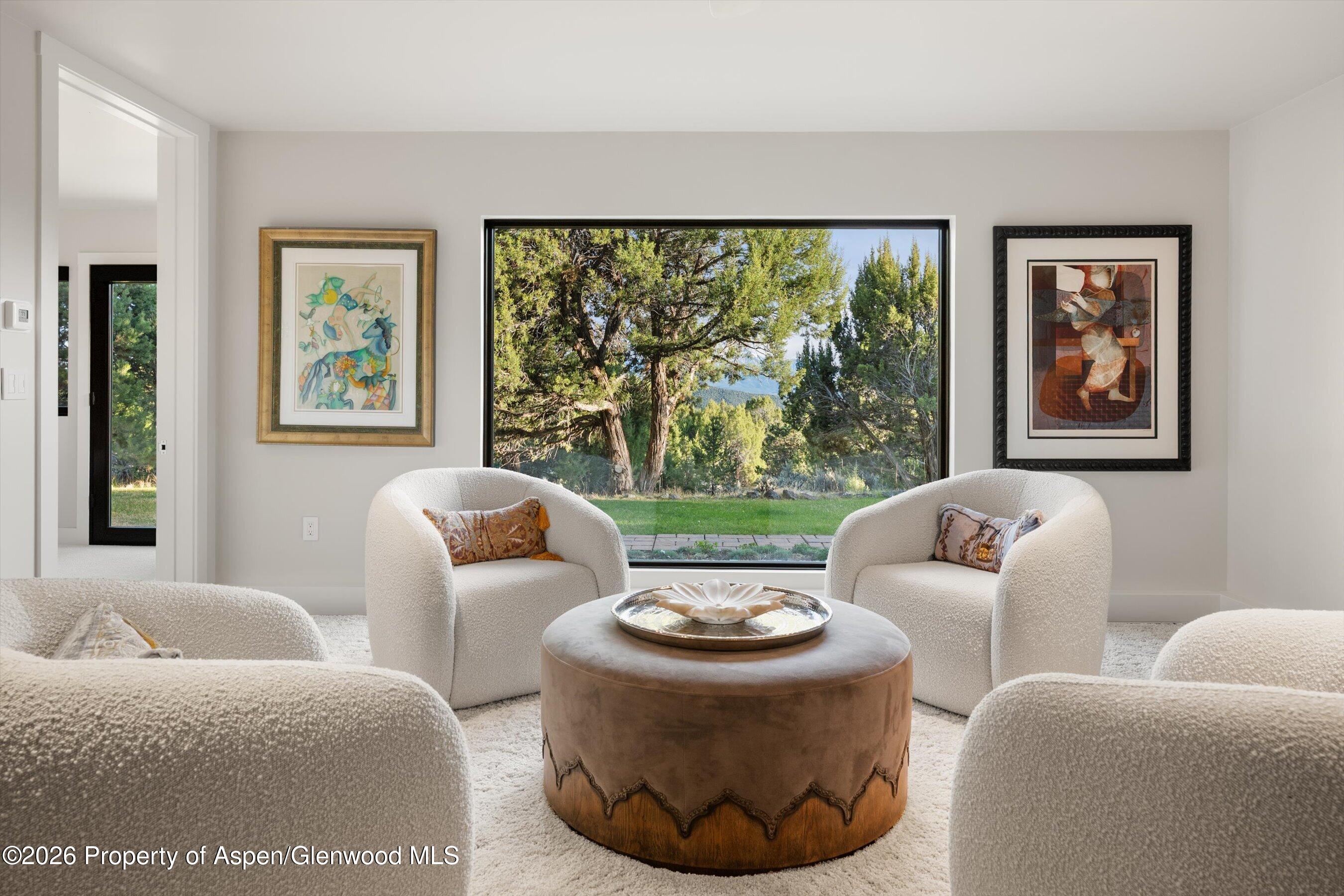 258 Monarch Road Glenwood Springs, CO 81601 - Photo 39 of 73 a living room with furniture and a large window