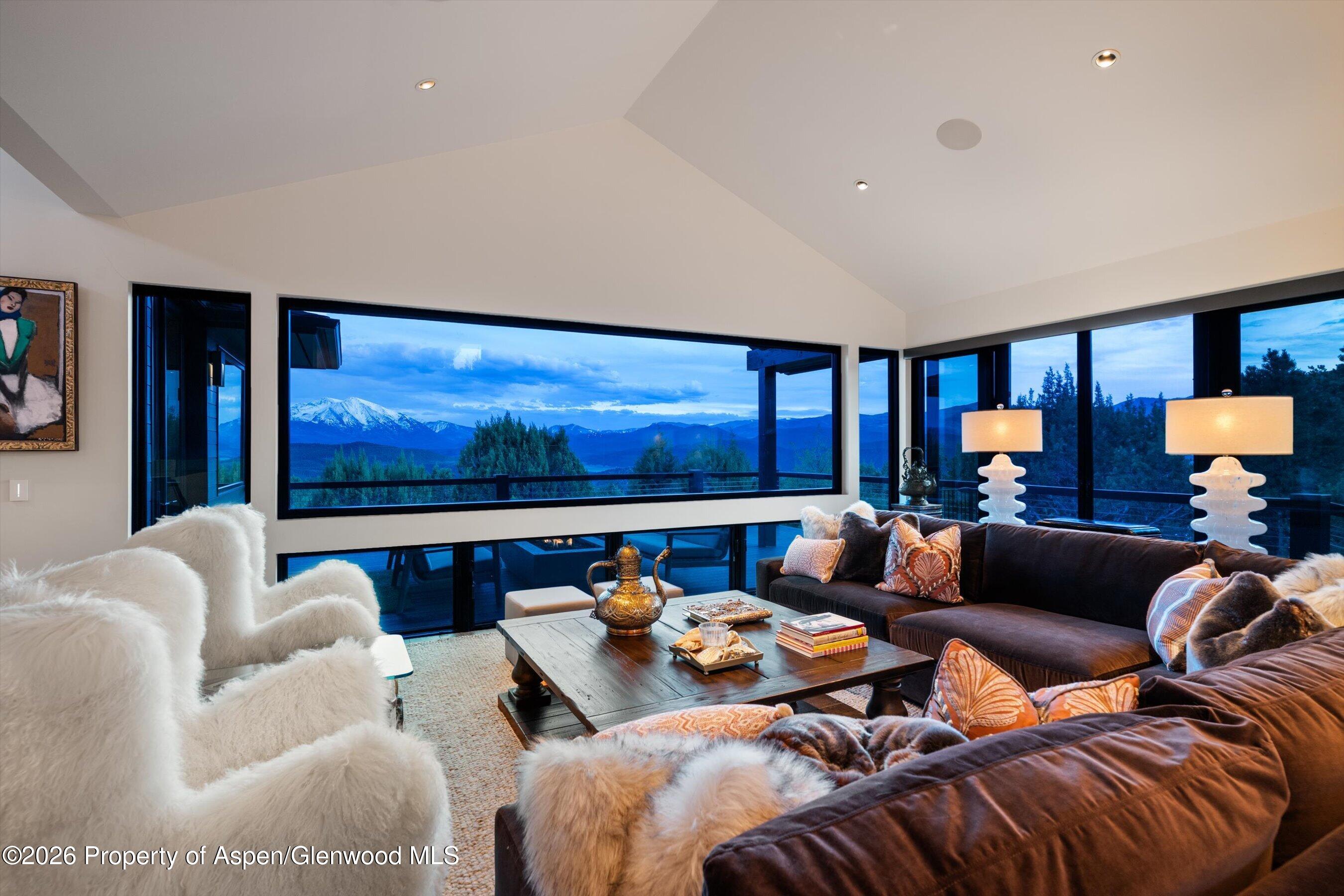 258 Monarch Road Glenwood Springs, CO 81601 - Photo 4 of 73 a living room with furniture a rug and a large window