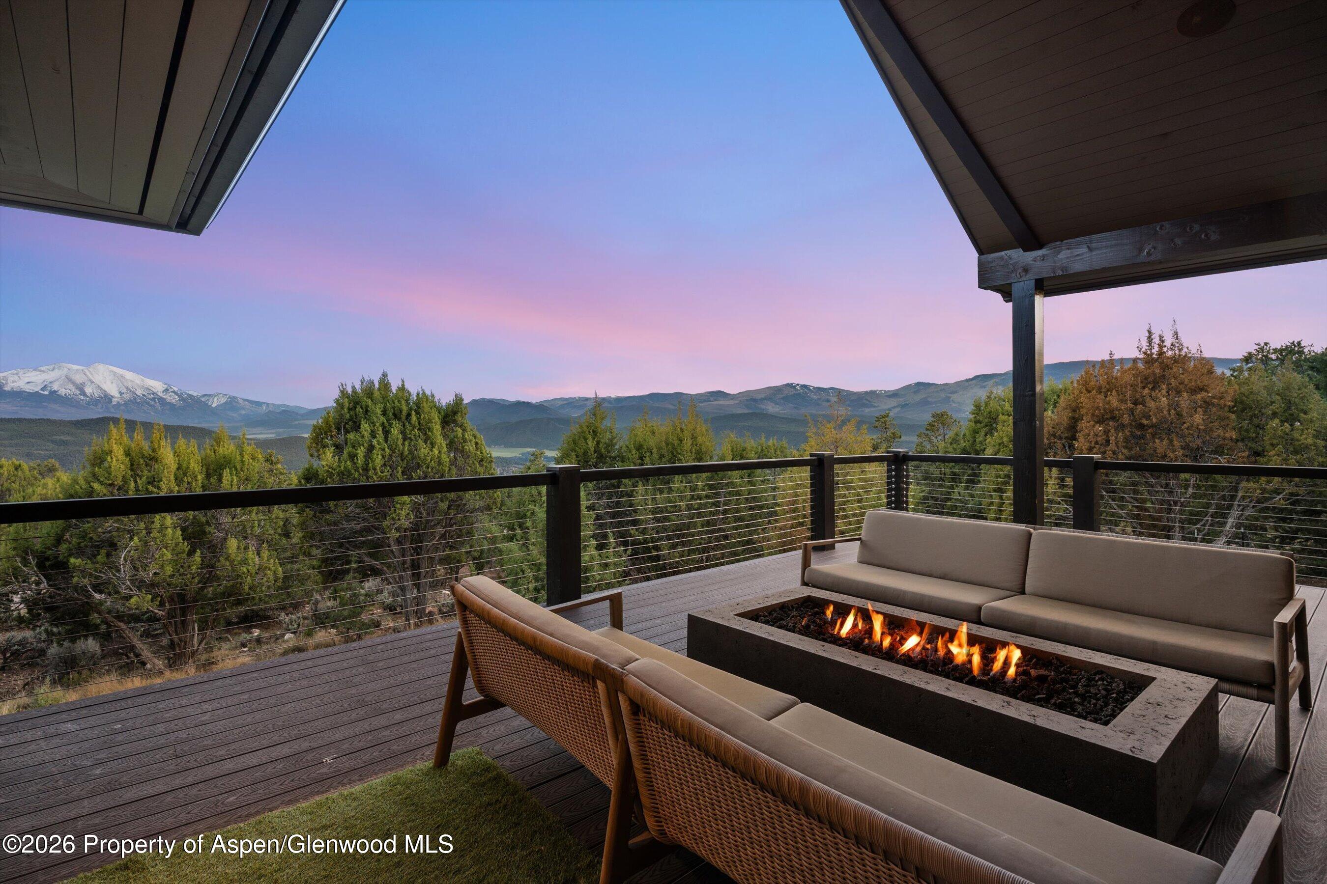 258 Monarch Road Glenwood Springs, CO 81601 - Photo 54 of 73 a view of a balcony with wooden floor and a table