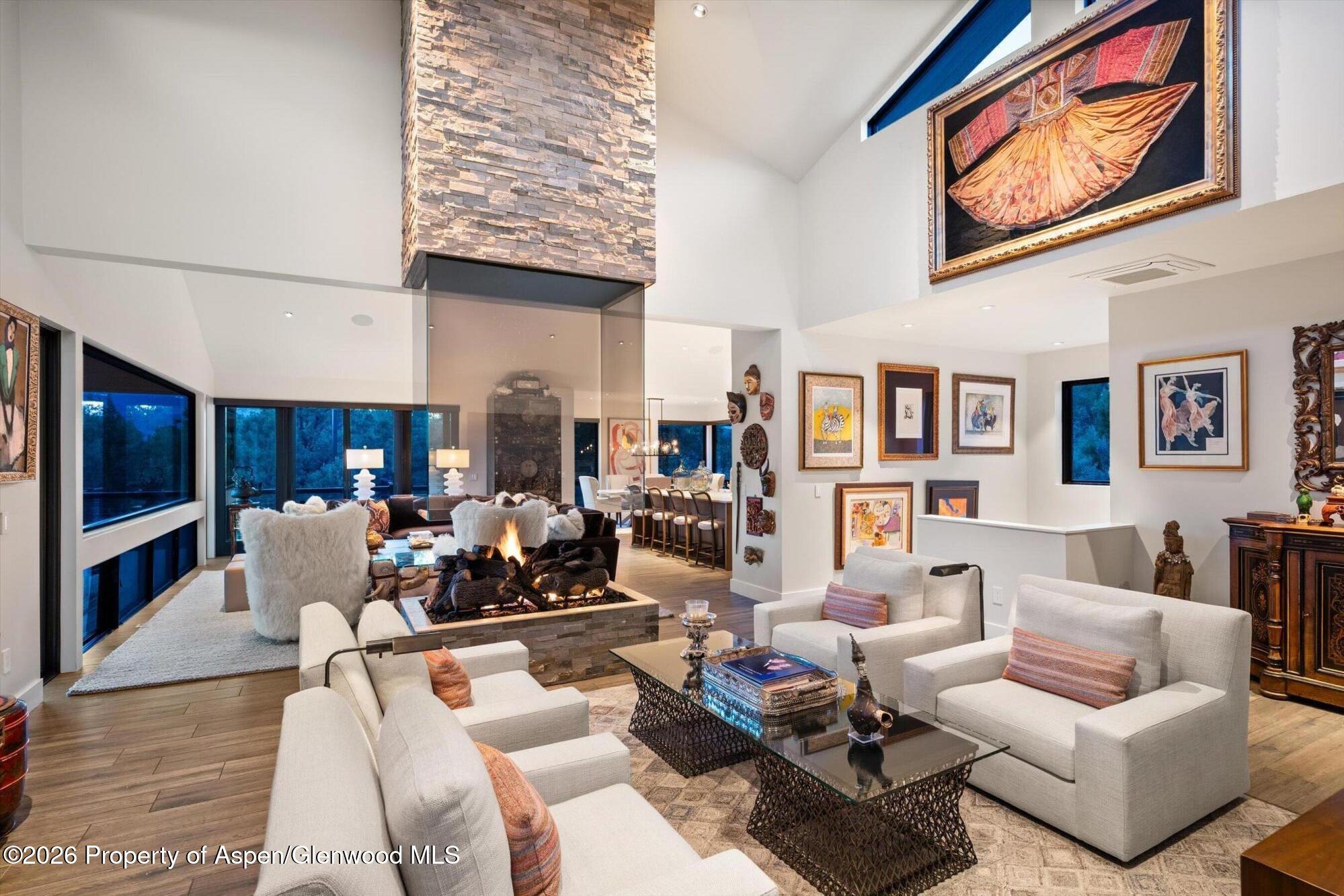 258 Monarch Road Glenwood Springs, CO 81601 - Photo 6 of 73 a living room with fireplace furniture and a flat screen tv