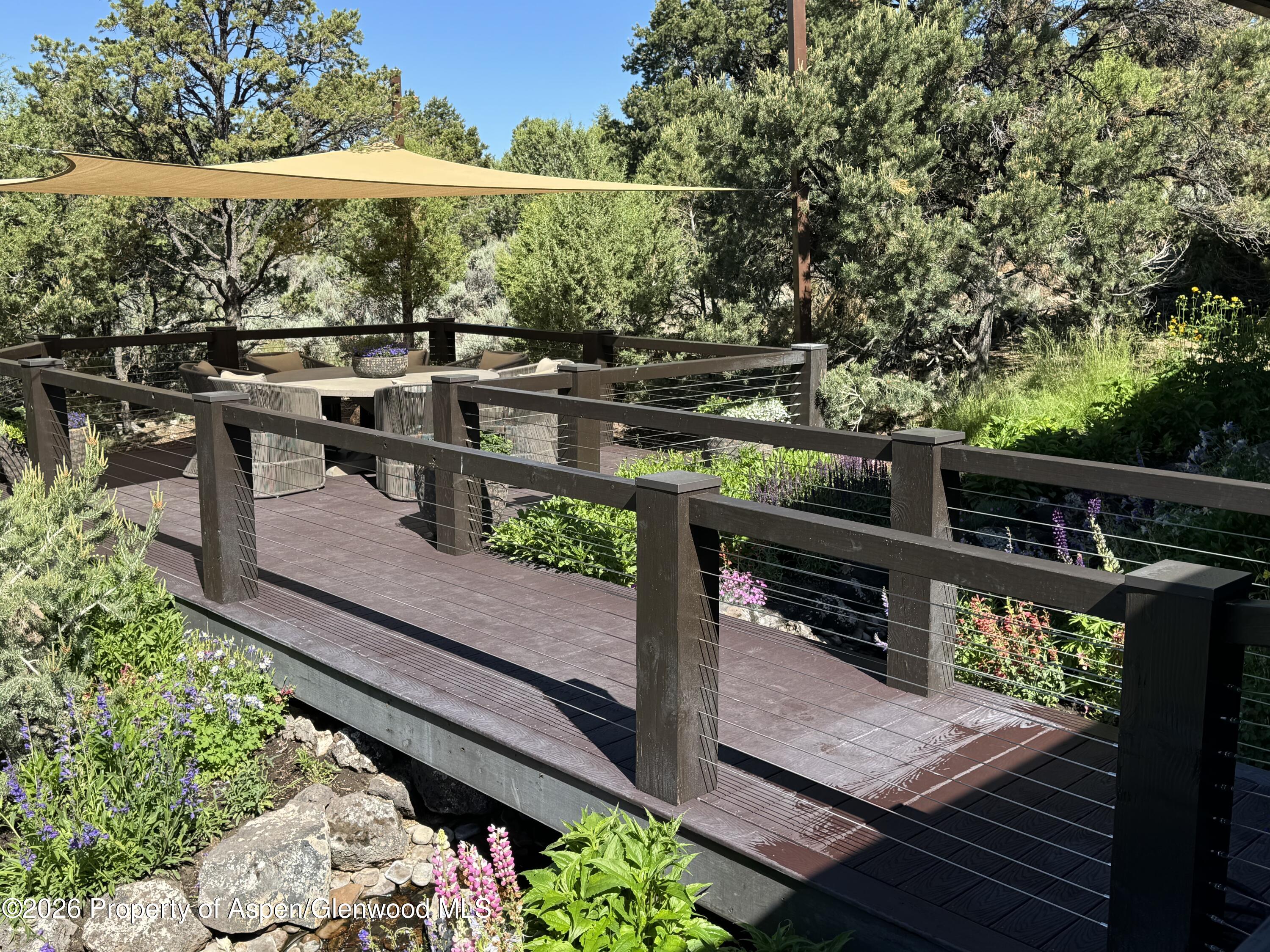 258 Monarch Road Glenwood Springs, CO 81601 - Photo 67 of 73 a view of a balcony with wooden floor and outdoor seating