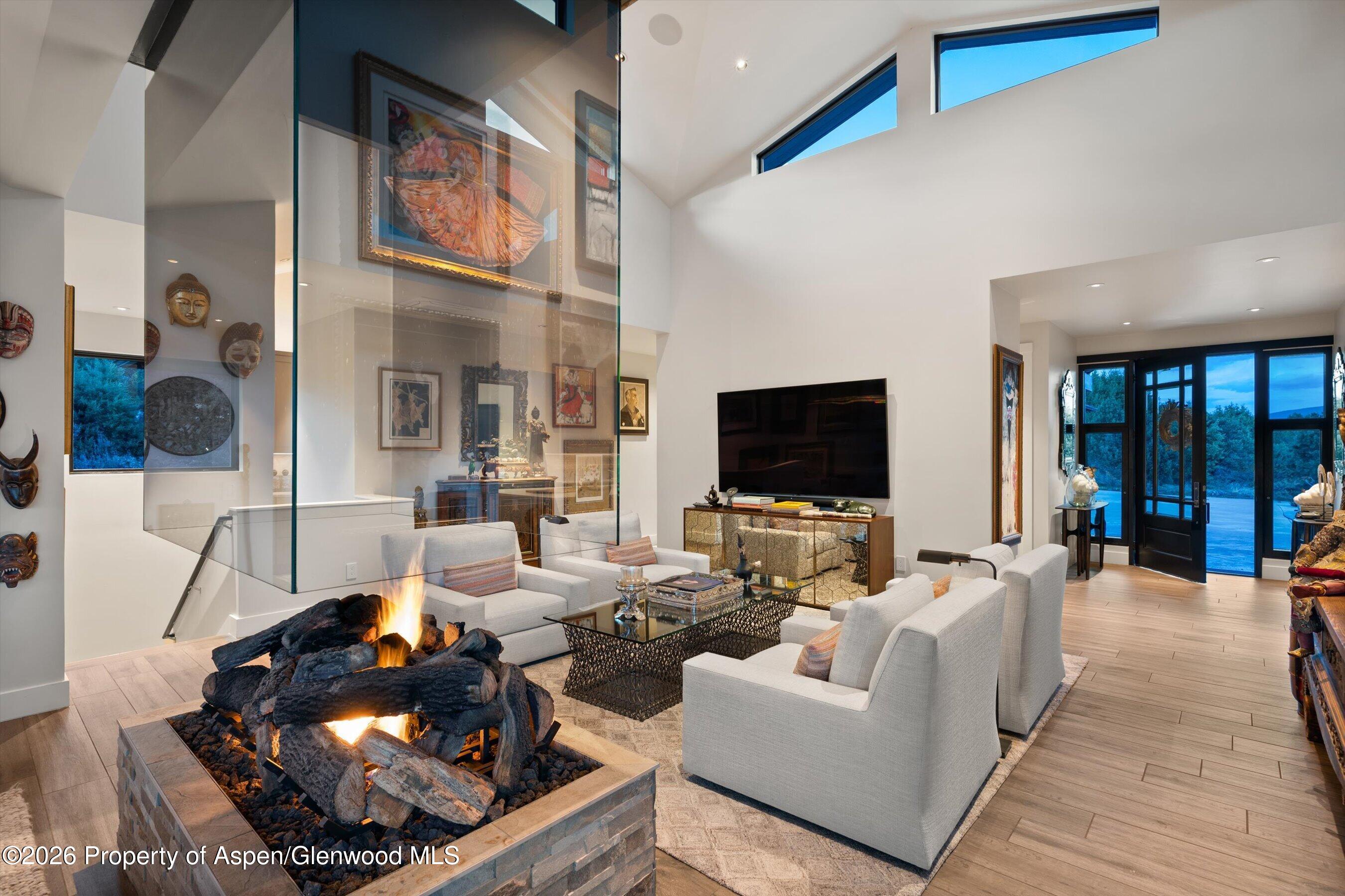 258 Monarch Road Glenwood Springs, CO 81601 - Photo 8 of 73 a living room with furniture and a flat screen tv